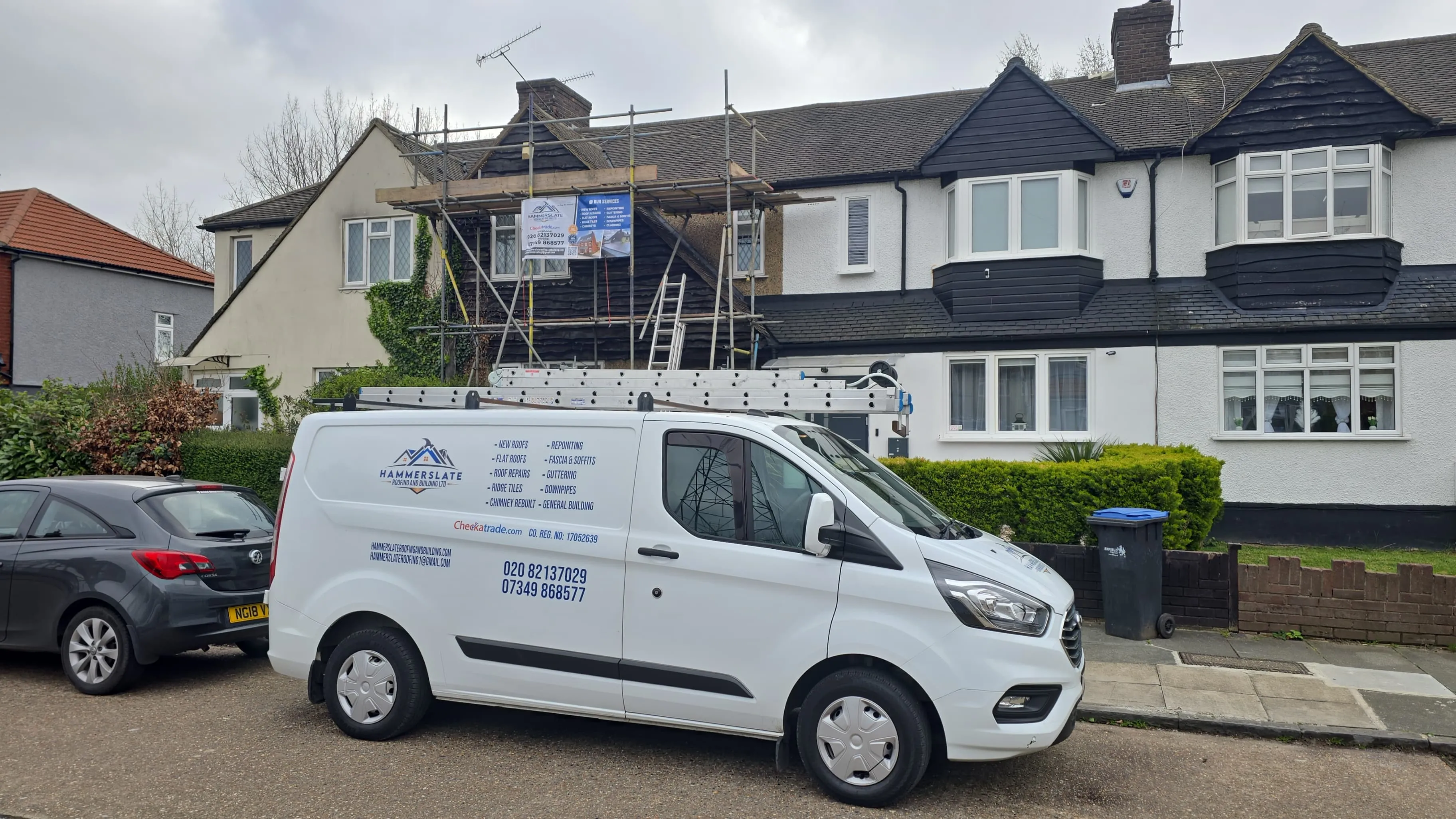 JS Roofers branded van parked outside a Gloucester property under repair